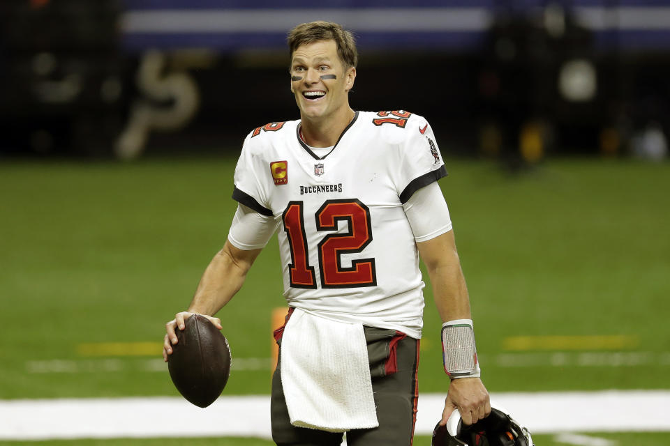 FILE - Tampa Bay Buccaneers quarterback Tom Brady leaves the field an NFL divisional round playoff football game against the New Orleans Saints in New Orleans, in this Sunday, Jan. 17, 2021, file photo. om Brady has agreed to a contract extension with the Buccaneers that provides the Super Bowl champions with much-needed salary cap relief and will help the seven-time NFL champion reach a goal of playing until heâ€™s at least 45. Brady posted a picture of himself on Twitter, signing the extension Friday, March 12, 2021, with the message: â€œIn pursuit of 8 ... LFG@ Buccaneers weâ€™re keeping the band together.â€ (AP Photo/Brett Duke, File)