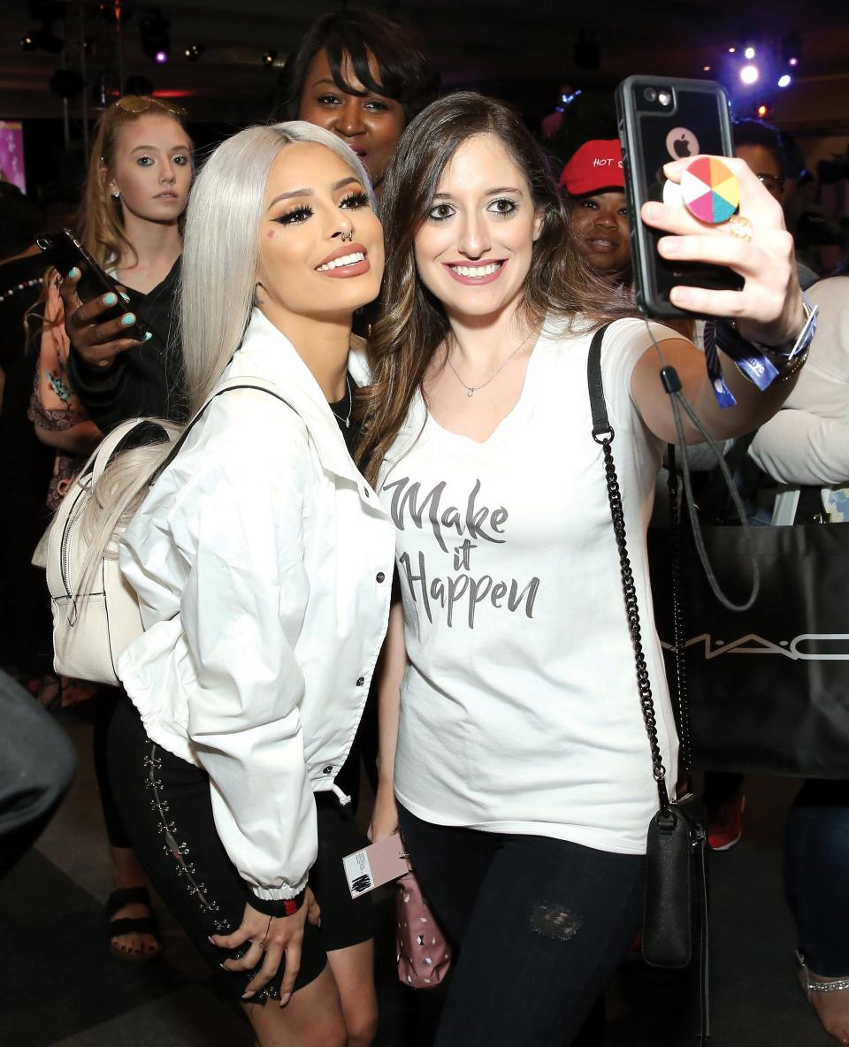 Isabel Bedoya poses with fans during Beautycon Festival NYC 2018.