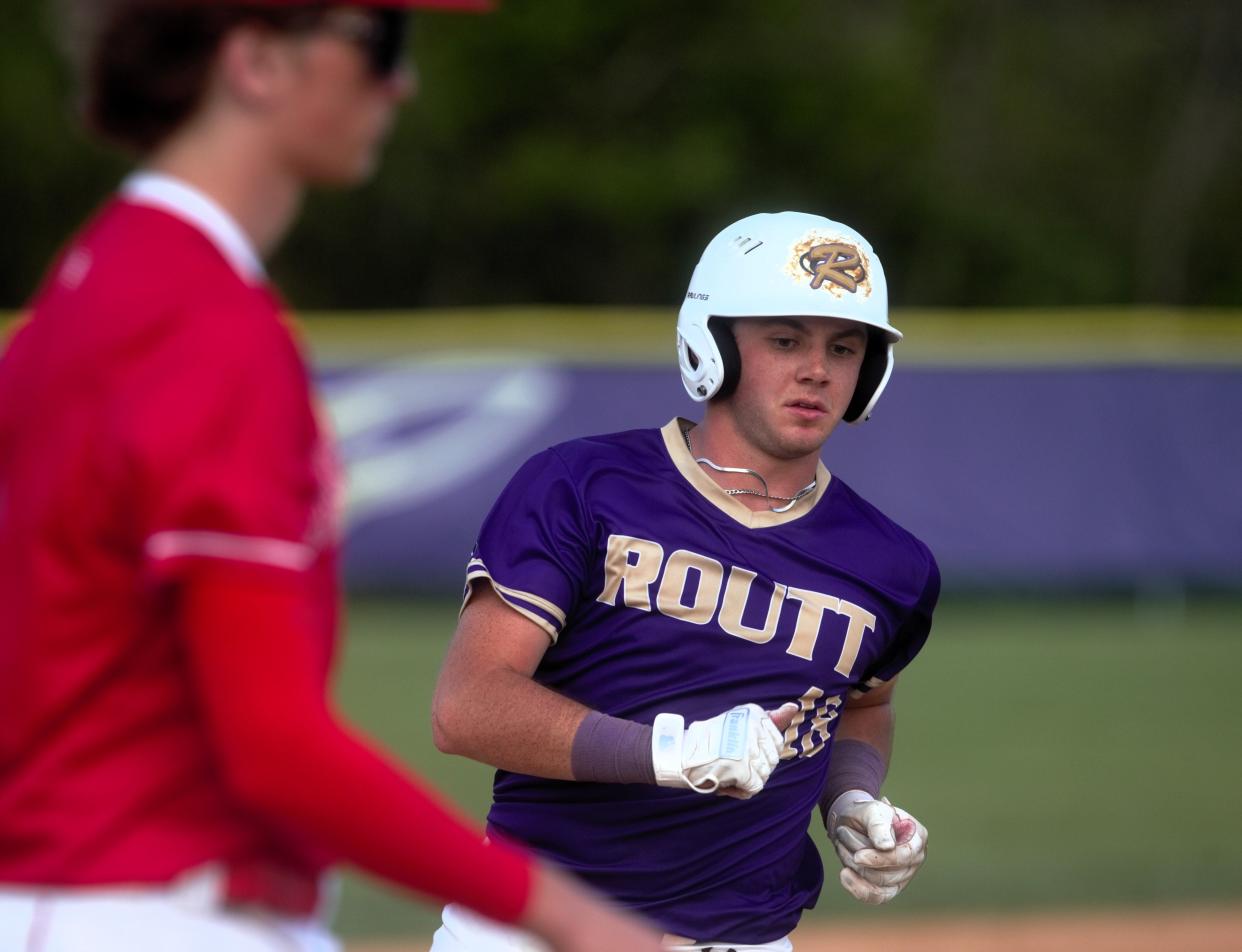 Jacksonville Routt's Isaac Long reaches third base against Jacksonville in a nonconference baseball game at Alumni Field on Saturday, April 27, 2024. Jacksonville won 13-8.