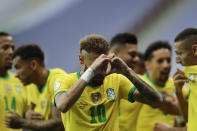 Brazil's Neymar celebrates scoring his side's second goal against Venezuela on a penalty kick during a Copa America soccer match at the National Stadium in Brasilia, Brazil, Sunday, June 13, 2021. (AP Photo/Eraldo Peres)