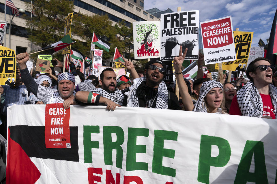 Anti-war activists rally during a pro-Palestinian demonstration asking to cease fire in Gaza, at Freedom Plaza in Washington, Saturday, Nov. 4, 2023. (AP Photo/Jose Luis Magana)