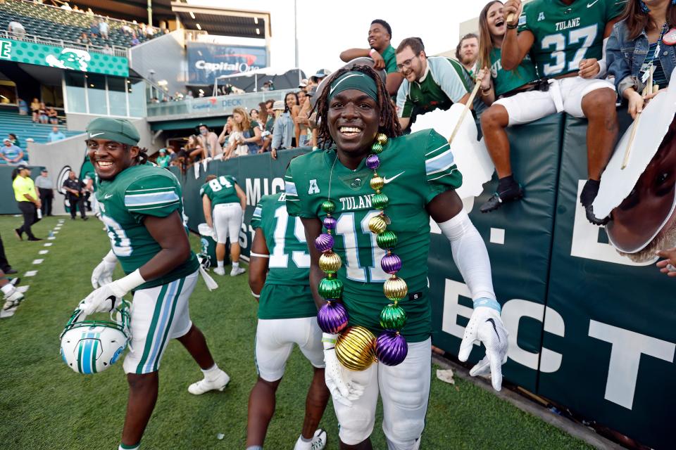 Tulane defensive back Jarius Monroe (11) celebrates after an NCAA college football game against Memphis in New Orleans, Saturday, Oct. 22, 2022. Tulane won 38-28. (AP Photo/Tyler Kaufman)