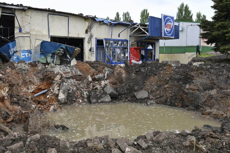 A crater of an explosion is seen after Russian shelling in Soledar, Donetsk region, Ukraine, Wednesday, May 18, 2022. (AP Photo/Andriy Andriyenko)