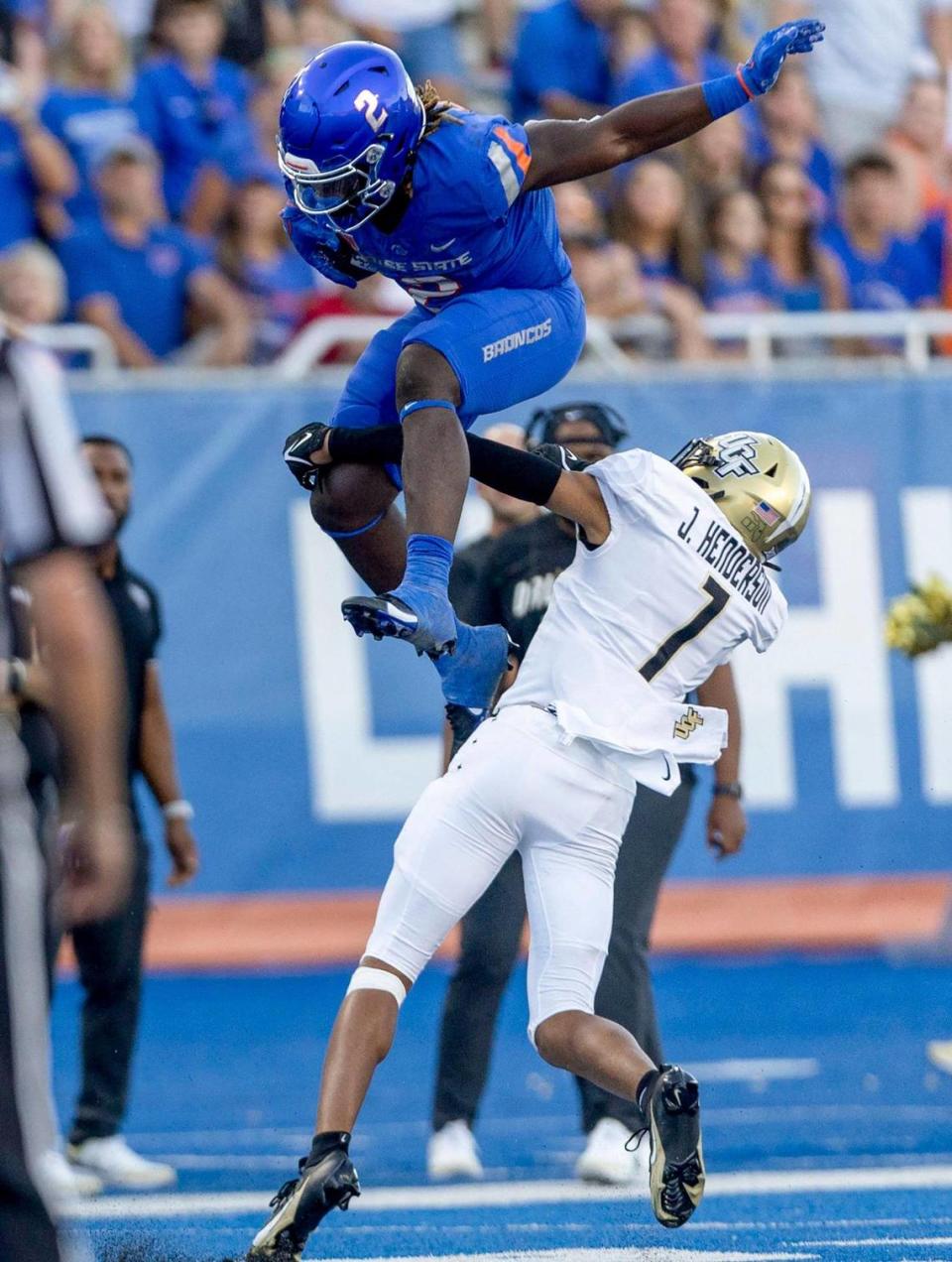 Boise State running back Ashton Jeanty leaps over UCF defensive back Fred Davis on a run in the second half, Saturday, Sept. 9, 2023.