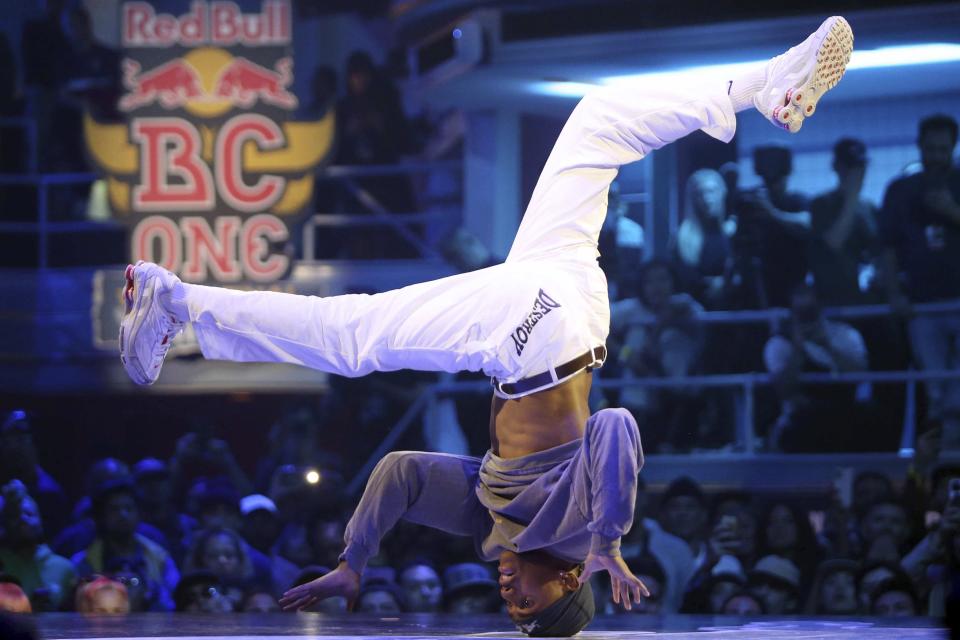 FILE - Lee of the Netherlands performs during the Red Bull BC One World Final break dancing competition, Saturday, Nov. 12, 2022, at the Hammerstein Ballroom in New York. The folks who allowed 3-on-3 basketball — also known as pick-up games at the local Y — into their grandiose spectacle and went along with the idea of handing out gold medals next summer for breakdancing are trying to lock down which new sports make the cut for the 2028 Los Angeles Games. Nine are under consideration, but the one that caught my eye was the flagged, non-contact version of the game that dominates the American sporting landscape but is barely a blip to the rest of the world. (AP Photo/Vera Nieuwenhuis, File)