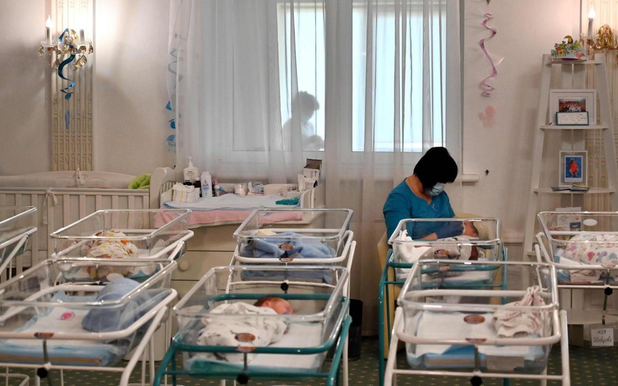 Newborn babies born to surrogate mothers await collection in Ukraine during the Covid pandemic