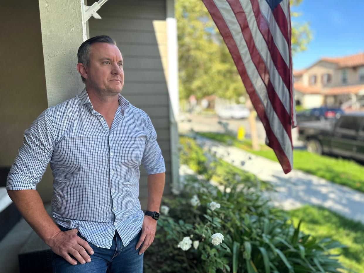 Nick Donoho, resident of The Vines at Riverpark, stands outside his townhome in Oxnard. The property owner has notified him of a 20% rent increase for the three-bedroom unit.
