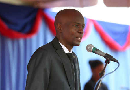 Haiti's President Jovenel Moise addresses the audience during an event marking the eighth anniversary of an earthquake and the beginning of the reconstruction of the presidential palace, in Port-au-Prince, Haiti January 12, 2018. REUTERS/Jeanty Junior Augustin