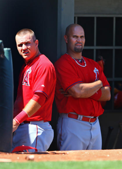 Mike Trout (left) and Albert Pujols combined for 64 home runs last season. (USAT)