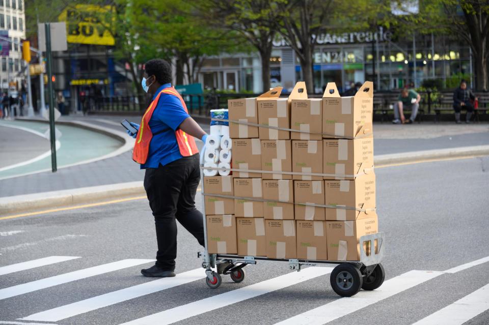 NEW YORK, NY - APRIL 14: Amazon Fresh delivery person works in Union Square during the coronavirus pandemic on April 14, 2020 in New York City. COVID-19 has spread to most countries around the world, claiming over 126,000 lives lost with over 1.9 million infections. (Photo by Noam Galai/Getty Images)