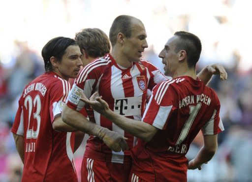 Bayern Munich's players celebrate scoring a goal during their German first division Bundesliga match vs Borussia Moenchengladbach, in the southern German city of Munich, on April 2. Defending champions Bayern Munich are up to third in the table and are at Nuremberg in the Bavarian derby on Saturday