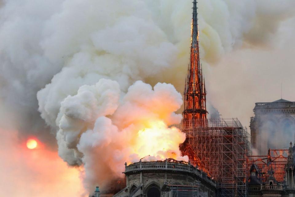 The fire ripped through Notre-Dame at 6.40pm on Monday, By 8pm, the blaze destroyed the cathedral's historic spire (AFP/GETTY)