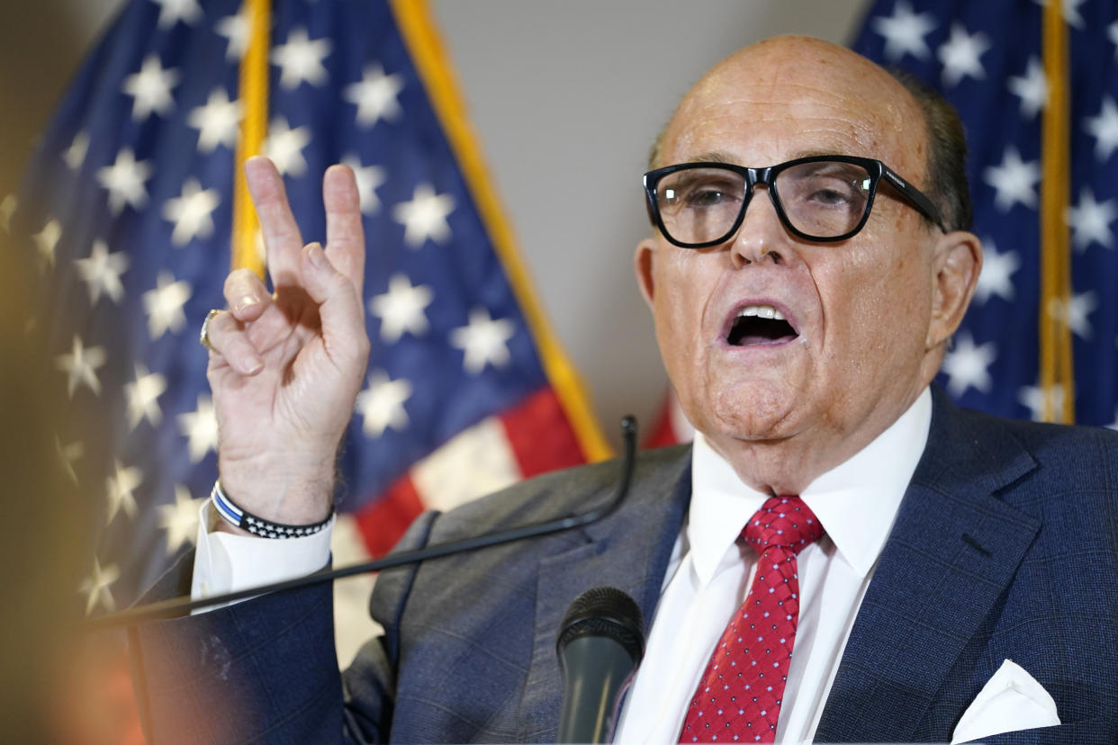 FILE - Former Mayor of New York Rudy Giuliani, a lawyer for President Donald Trump, speaks during a news conference at the Republican National Committee headquarters, Thursday Nov. 19, 2020, in Washington. President Donald Trump says his personal attorney Rudy Giuliani has tested positive for coronavirus.  The president on Sunday, Dec. 6, 2020 confirmed in a tweet that Giuliani had tested positive for the virus. Giuliani has traveled extensively to battleground states in effort to help Trump subvert his election loss. (AP Photo/Jacquelyn Martin, file)