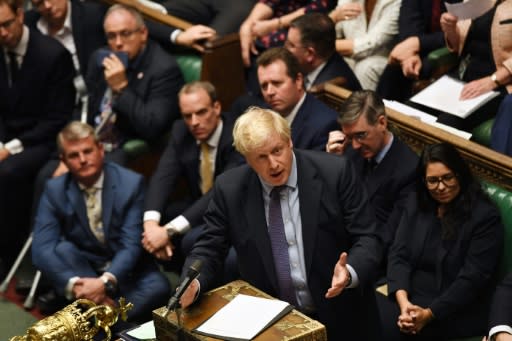 Prime Minister Boris Johnson (C) reiterated his desire to stick to the October 31 date and said Britain would step up preparations in case of a disorderly "no deal" exit