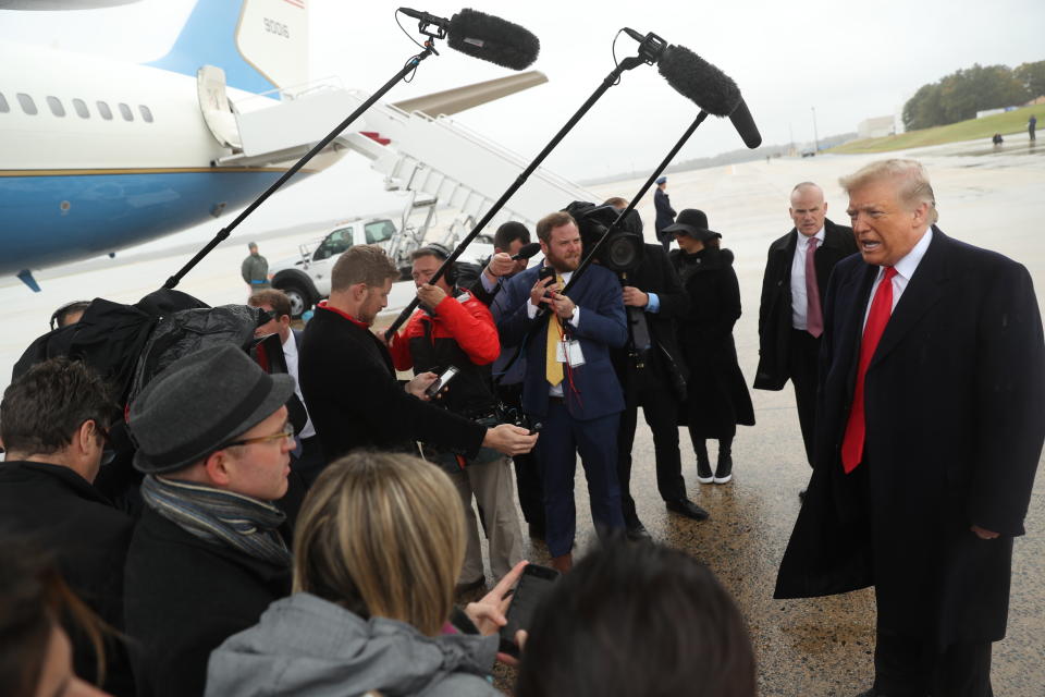 President Donald Trump speaks to the media at Air Force One at Andrews Air Force Base, Saturday, Oct. 27, 2018, before travelling to Indianapolis to speak at the 91st Annual Future Farmers of America Convention and Expo. (AP Photo/Andrew Harnik)