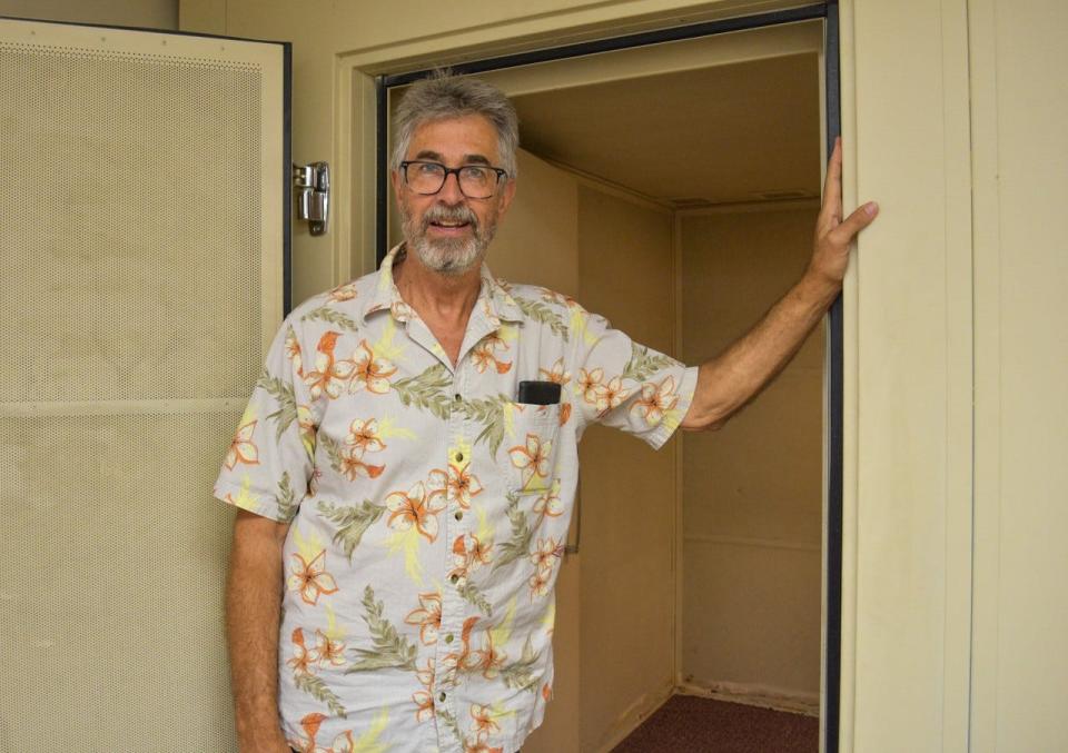 Audiologist Bob Gamble stands in front of one of the soundproof rooms in his now-empty office in Fremont.  The rooms will be dismantled now that Gamble has retired.