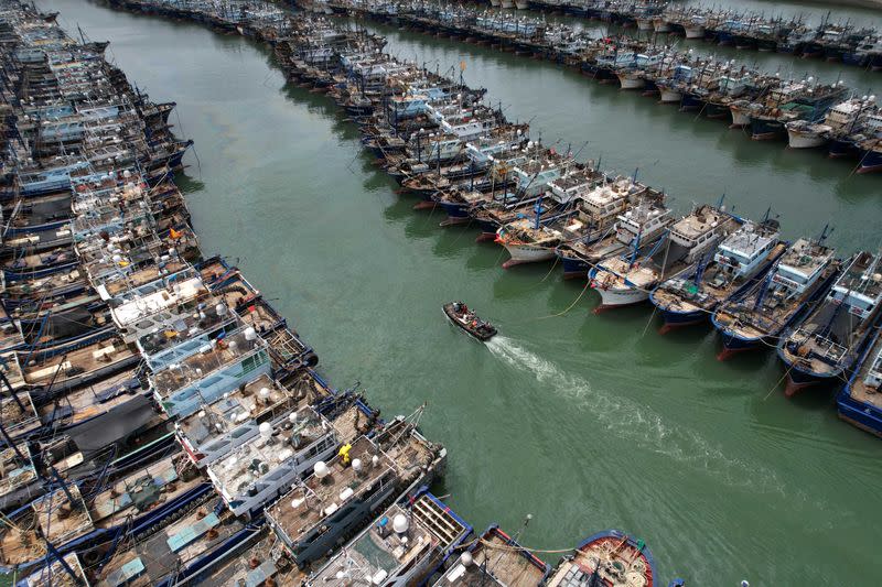 Fishing boats at a port as typhoon Doksuri approaches, in Xiamen