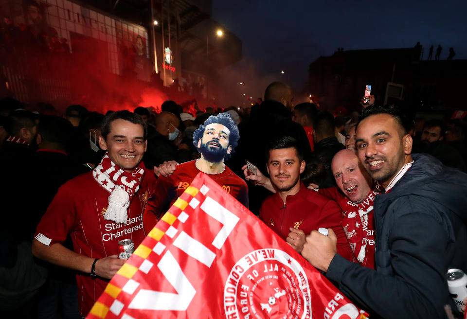 Liverpool fans celebrate outside Anfield. (Photo by Martin Rickett/PA Images via Getty Images)