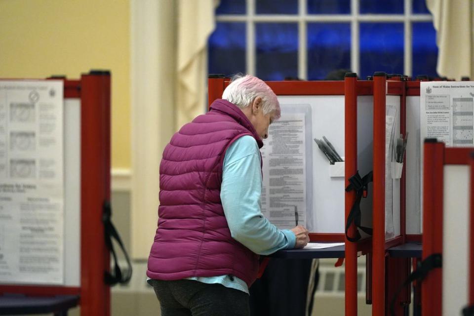 A voter marks a ballot at the polling station in Kennebunk, Maine, Tuesday, March 5, 2024.  Super Tuesday elections are being held in 16 states and one territory. Hundreds of delegates are at stake, the biggest haul for either party on a single day.  (AP Photo/Michael Dwyer)