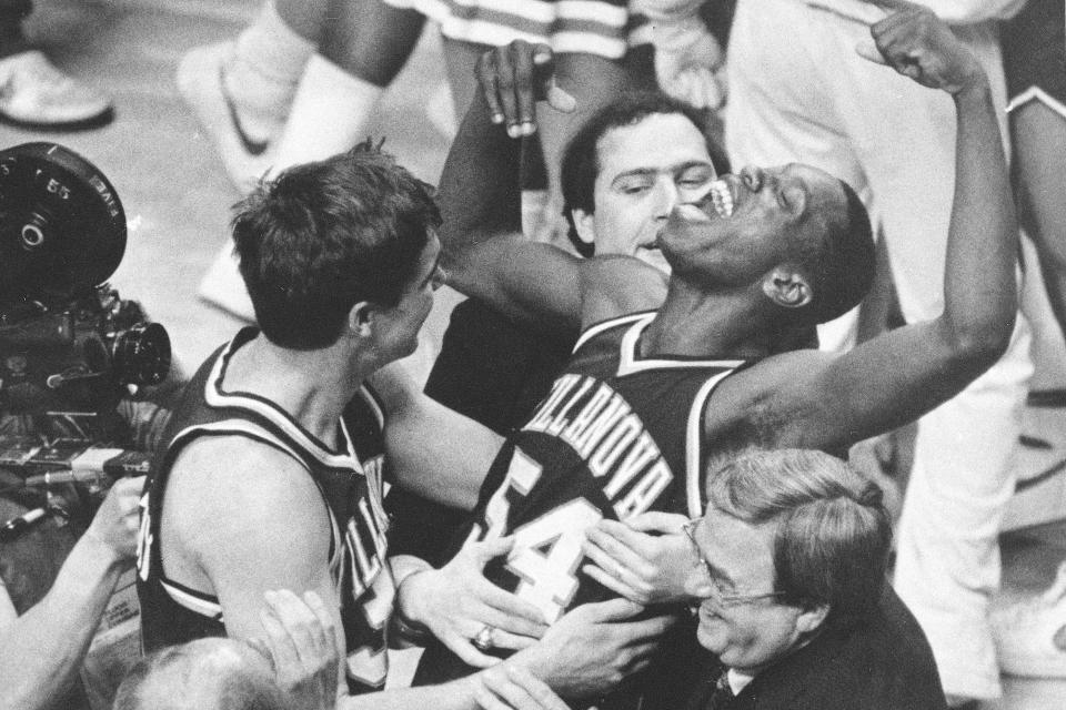 FILE - In this April 1, 1985, file photo, Villanova's Ed Pinckney (54) yells out as he is surrounded by teammates after defeating Georgetown 66-64 in the NCAA college basketball Final Four championship game, in Lexington, Ky. (AP Photo/Gary Landers, File)