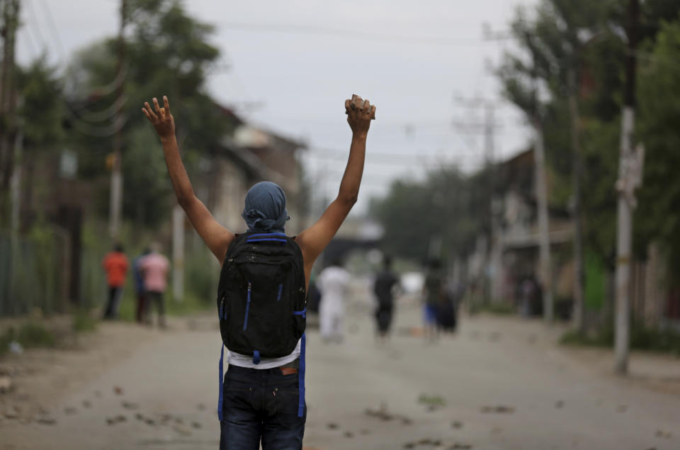 A Kashmiri protester shouts slogans during an anti-India protest in Srinagar, India, Friday, Aug. 9, 2019. (AP Photo/Altaf Qadri)