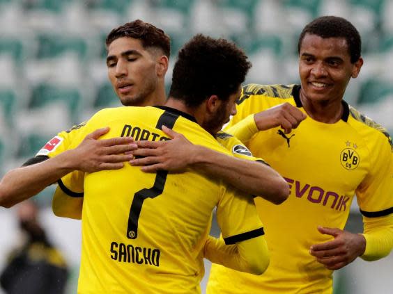 Borussia Dortmund’s Achraf Hakim celebrates with Jadon Sancho (POOL/AFP via Getty Images)