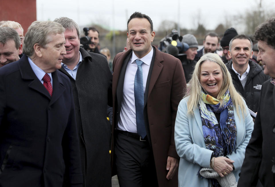 Ireland's Prime Minister Leo Varadkar, center, in Ennis, Ireland, Friday Feb. 7, 2020, on the last day of campaigning ahead of the general election. Irish voters will choose a new parliament on Saturday, and may have bad news for the two parties that have dominated the country’s politics for a century, Fianna Fail and Fine Gael. Polls show a surprise surge for Sinn Fein, the party historically linked to the Irish Republican Army and its violent struggle for a united Ireland. (Brian Lawless/PA via AP)