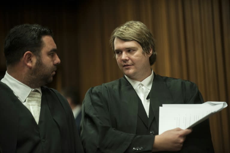 Advocate Christiaan Sevenster (R) talks with a collegue on September 2, 2015 at the Pretoria Noth Gateng High court