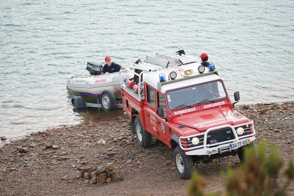 Personnel at Barragem do Arade reservoir, in the Algave, Portugal, as searches begin as part of the investigation into the disappearance of Madeleine McCann. The area is around 50km from Praia da Luz where Madeleine went missing in 2007. Picture date: Tuesday May 23, 2023. PA Photo. See PA story POLICE Portugal. Photo credit should read: Yui Mok/PA Wire 