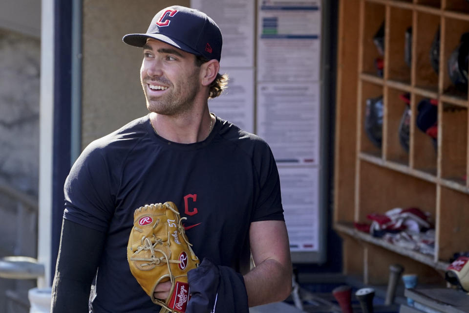 Cleveland Guardians' Shane Bieber walks through the dugout during a workout ahead of Game 1 of baseball's American League Division Series against the New York Yankees, Monday, Oct. 10, 2022, in New York. (AP Photo/John Minchillo)