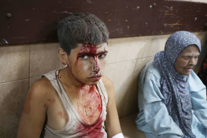 Injured Palestinians are brought to Al-Aqsa Hospital to receive medical treatment after Israeli forces hit people near Al-Aqsa hospital in Deir al-Balah, Gaza Strip. Omar Ashtawy/APA Images via ZUMA Press Wire/dpa