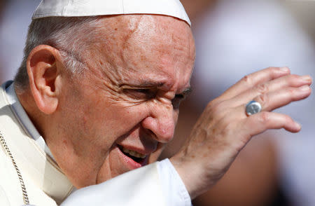 Pope Francis waves as he arrives to lead the Wednesday general audience in Saint Peter's square at the Vatican, June 20, 2018. REUTERS/Stefano Rellandini