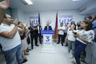 Armenian acting Prime Minister Nikol Pashinyan speaks to his party colleagues after parliamentary elections in Yerevan, Armenia, Monday, June 21, 2021. Results released Monday showed the party of Pashinyan won the snap parliamentary elections he called to ease anger over a peace deal he signed with Azerbaijan. (Tigran Mehrabyan/PAN Photo via AP)