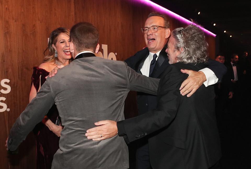 Group hug! Taron Egerton, Rita Wilson, Tom Hanks and Dexter Fletcher share a post-show embrace. 