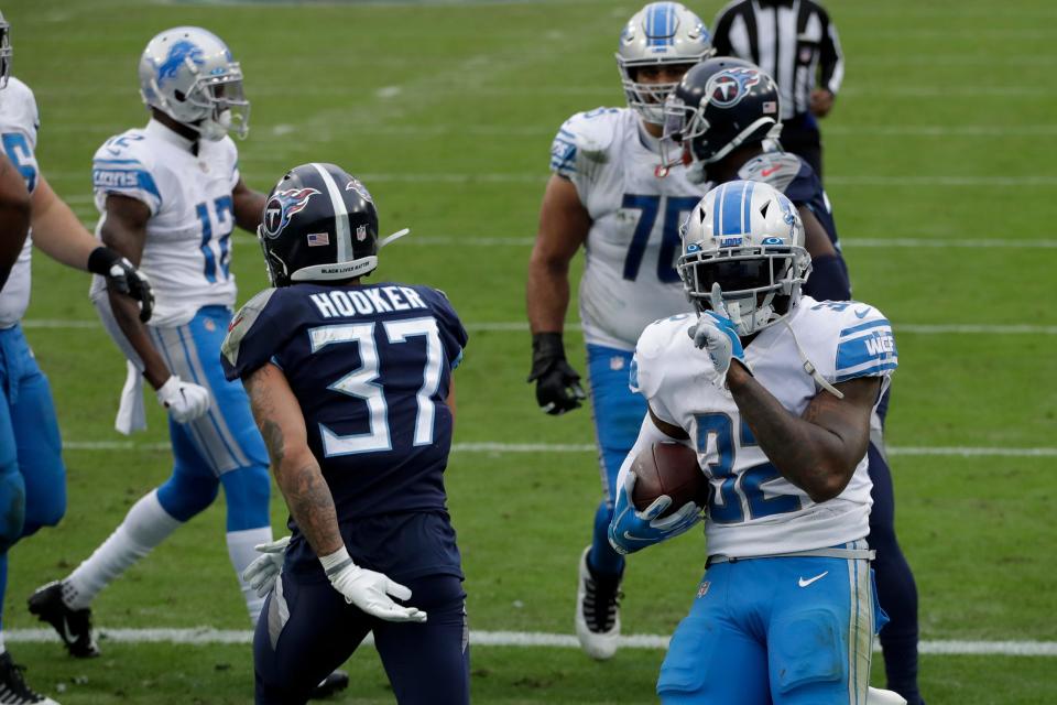 Lions running back D'Andre Swift celebrates after scoring against the Titans during the first half on Sunday, Dec. 20, 2020, in Nashville, Tennessee.