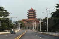 Vehicles travel on a road near the Yellow Crane Tower in Wuhan, the epicentre of the novel coronavirus outbreak