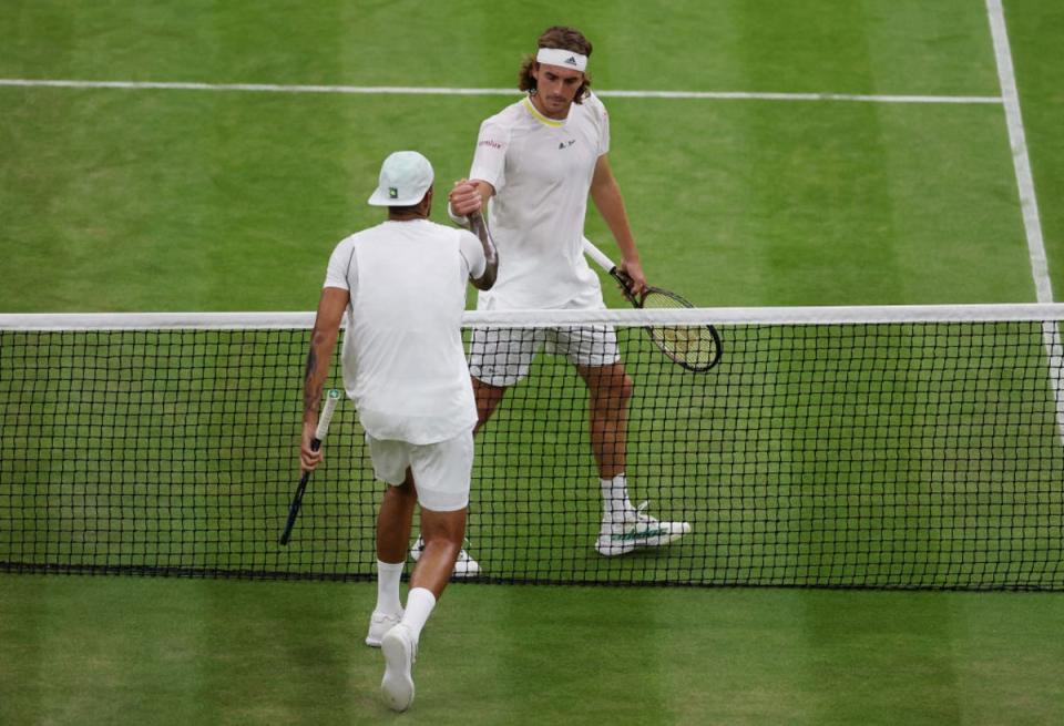 The players shook hands at the net but shots were fired afterwards (Getty Images)