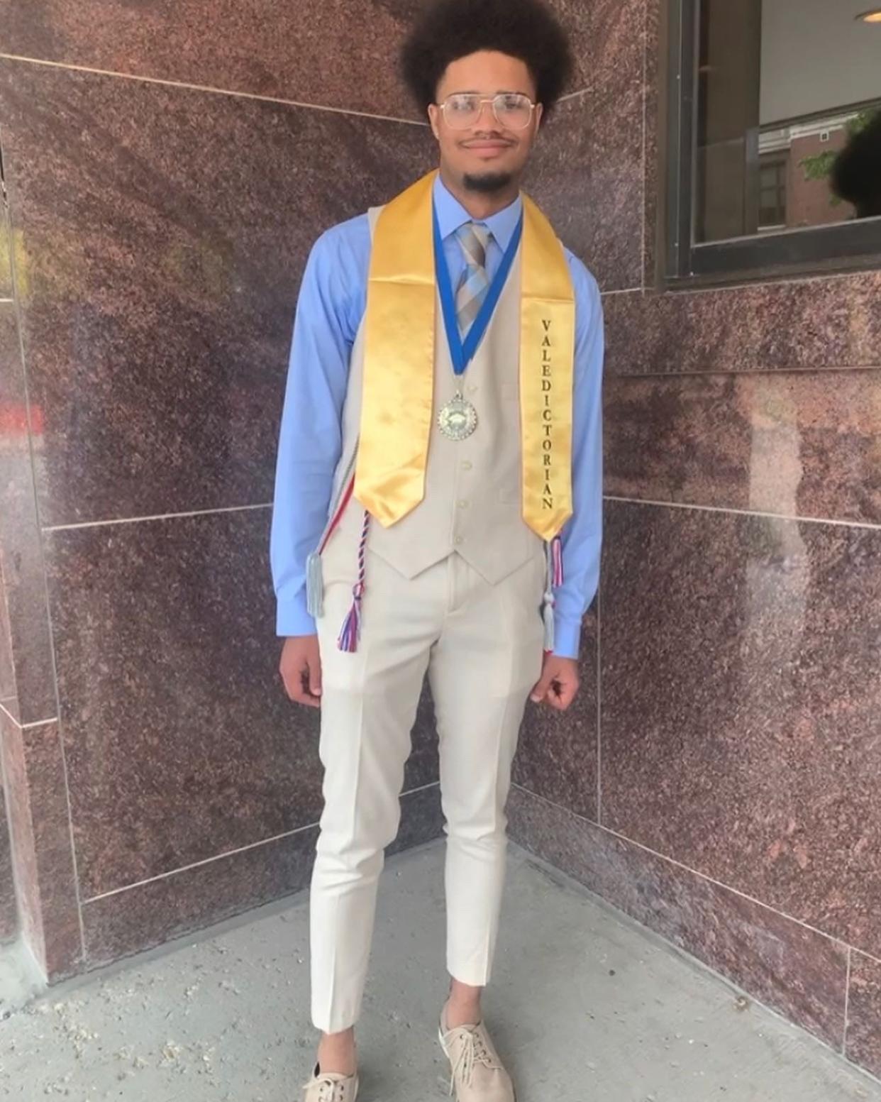 Milwaukee Marshall High School valedictorian Jaden Bandy poses at his graduation ceremony on Tuesday, May 31, 2022 at the University of Wisconsin-Milwaukee Panther Arena.