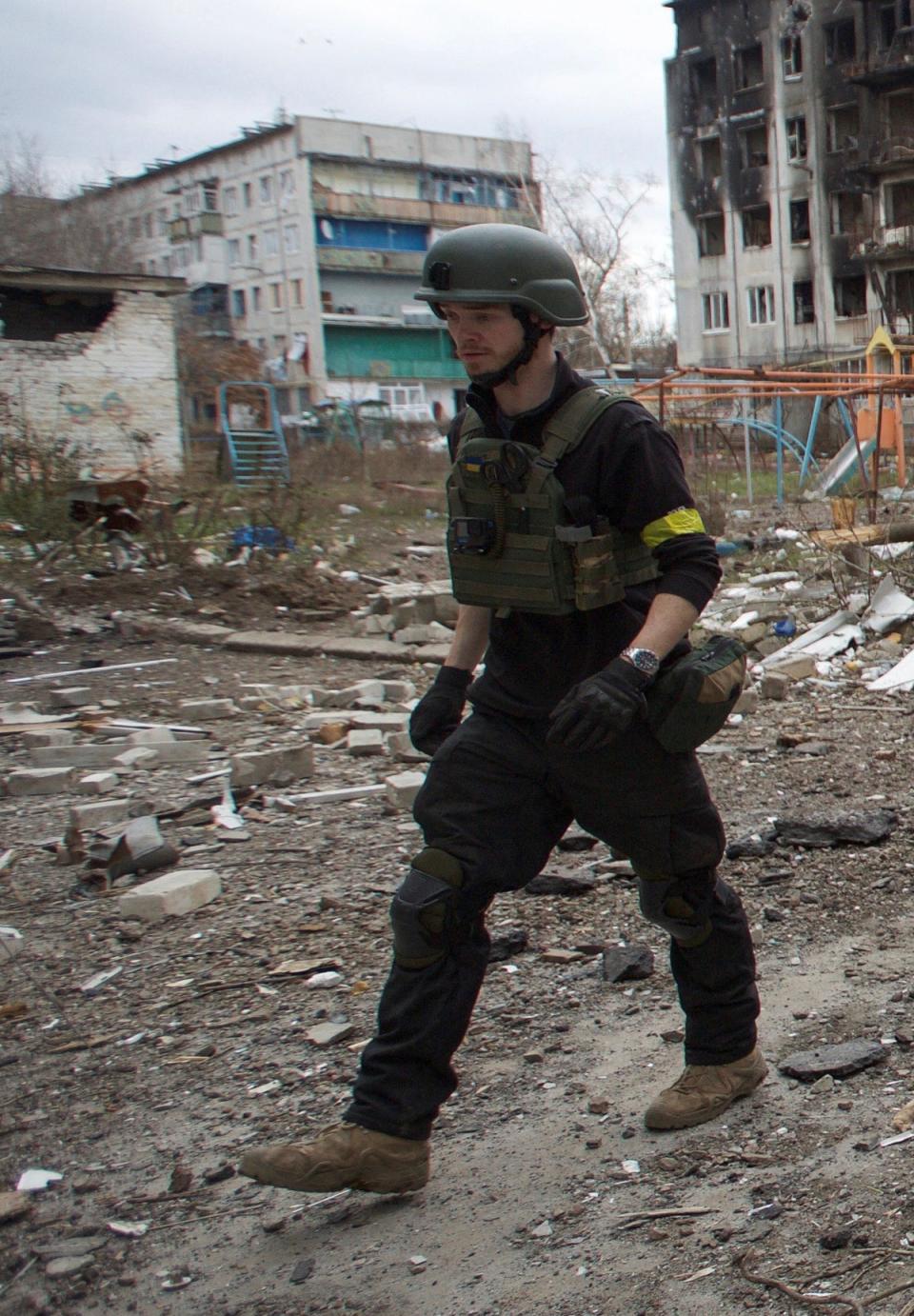 Mr Parry in Bakhmut, Donetsk region,  following a Russian missile strike (Reuters)