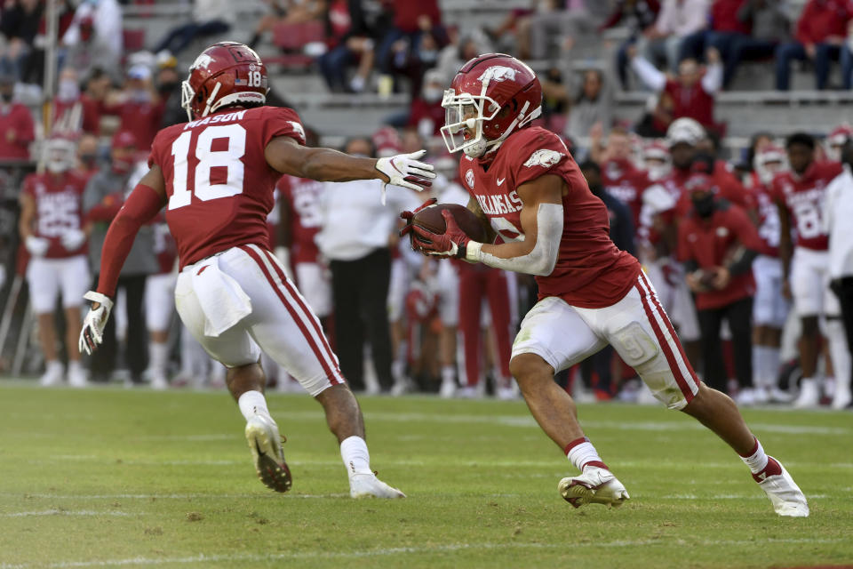 Arkansas defensive back Greg Brooks Jr. (9) returns an interception against Mississippi during the second half of an NCAA college football game Saturday, Oct. 17, 2020, in Fayetteville, Ark. (AP Photo/Michael Woods)