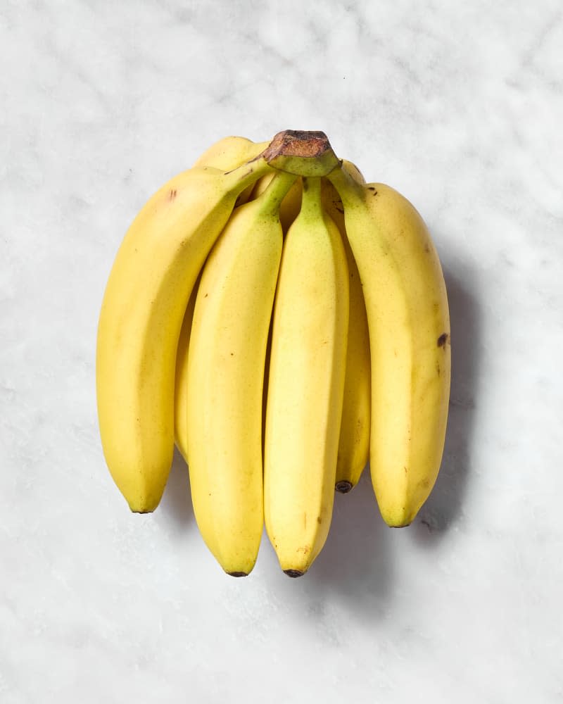 shot of bananas on a counter.