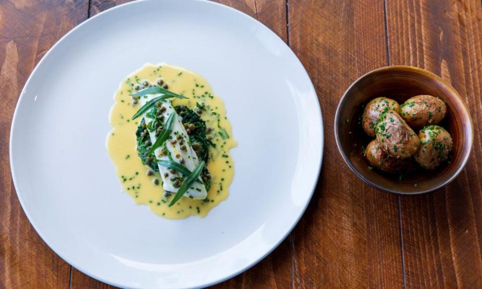 Plaice fillet in a buttery sauce and new potatoes