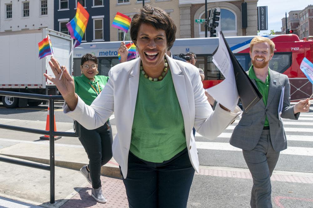 District of Columbia Mayor Muriel Bowser, center, arrives for a news conference ahead of DC Pride events, Friday, June 10, 2022, in Washington. (AP Photo/Jacquelyn Martin)