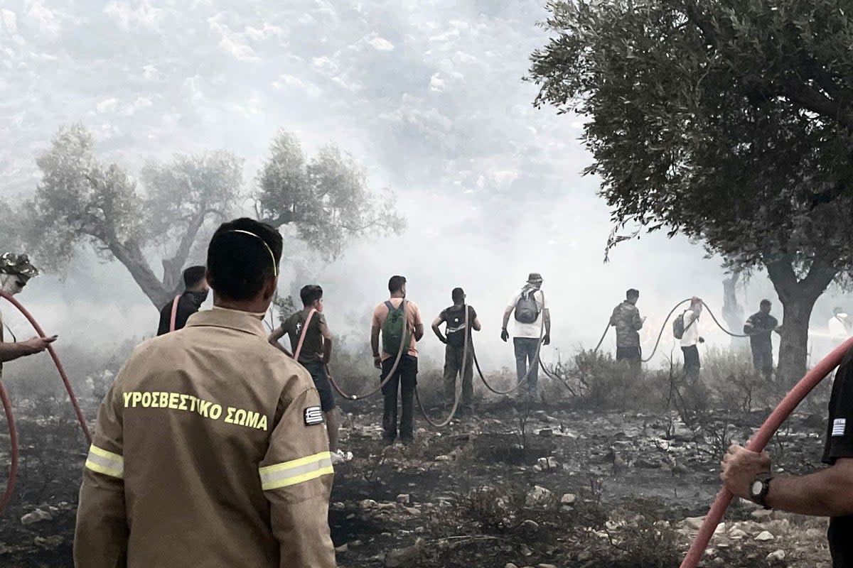 Emergency services trying to put out wildfires on Rhodes (Sarah George/PA) (PA Media)