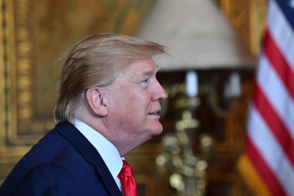 US President Donald Trump makes a video call to the troops stationed worldwide at the Mar-a-Lago estate in Palm Beach Florida, on December 24, 2019. (Photo by Nicholas Kamm / AFP) (Photo by NICHOLAS KAMM/AFP via Getty Images)