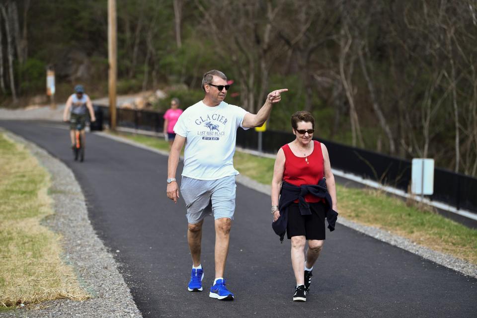 Randall and Cathy Carpenter walk on a new section of the Northshore Greenway on Wednesday, March 1, 2023. A new boardwalk connects the greenway from Concord Park to the greenway on the north side of Northshore Dr. "Before they put in this (boardwalk), you had to take your life in your own hands trying to cross Northshore," said Randall Carpenter. The couple often walk the 4-mile hike from The Cove to the roundabout at Concord Rd and back. 