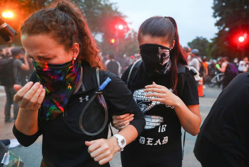 Police clash with protestors attempting to pull down statue of U.S. President Andrew Jackson in front of the White House in Washington