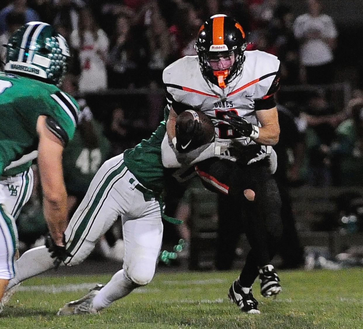 Marlington's Beau Himmelheber carries the ball against West Branch, Friday, Sept. 29, 2023.