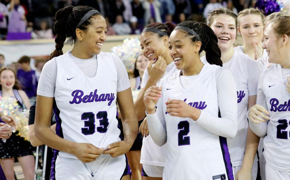 Bethany's Talia Vann (33) and Zya Vann (2) celebrate following the class 4A girls state championship basketball game between Bethany and Lincoln Christian at the State Fair Arena in Oklahoma City, Saturday, March 9, 2024.
