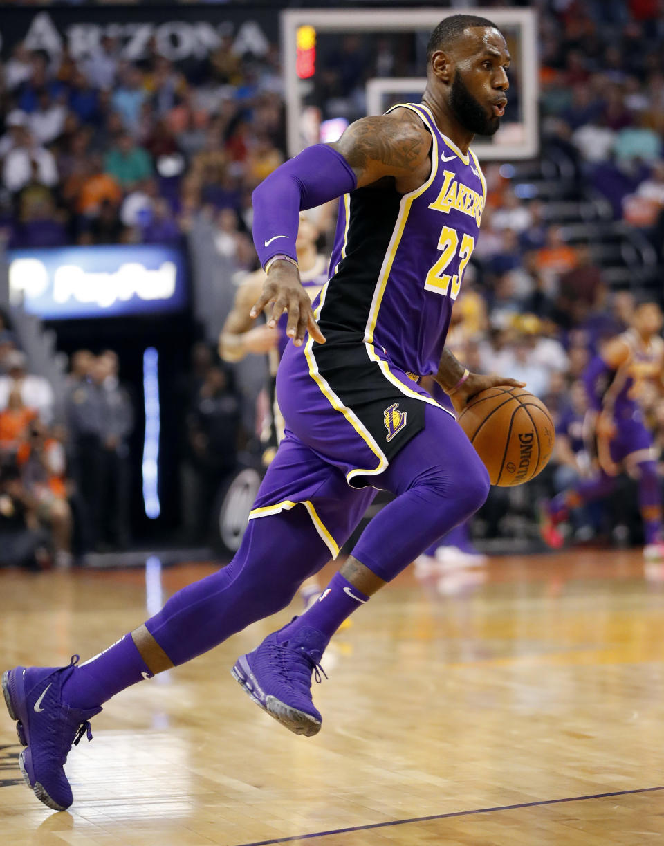 Los Angeles Lakers forward LeBron James (23) drives against the Phoenix Suns during the first half of an NBA basketball game, Wednesday, Oct. 24, 2018, in Phoenix. (AP Photo/Matt York)